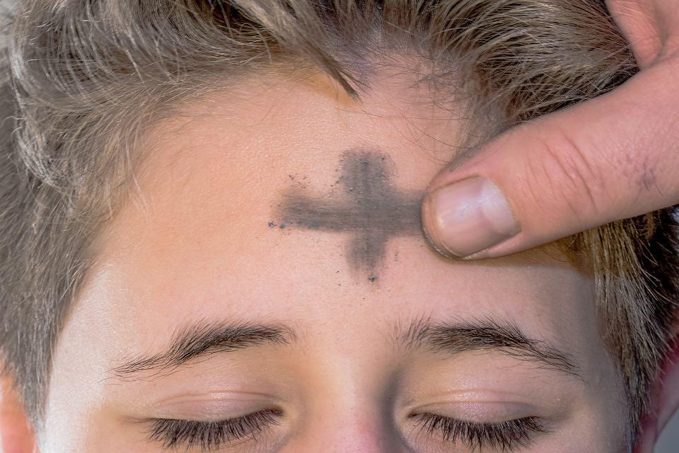 Marking ashes on the forehead