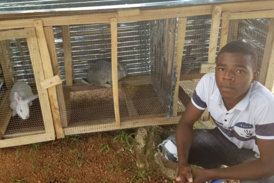 HAPIGro program youth with his animals.