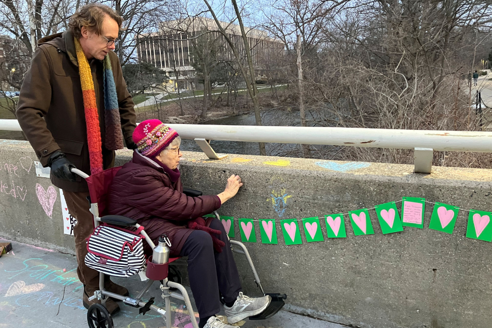 Man with woman in wheelchair