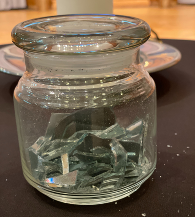 Jar with broken mirror inside