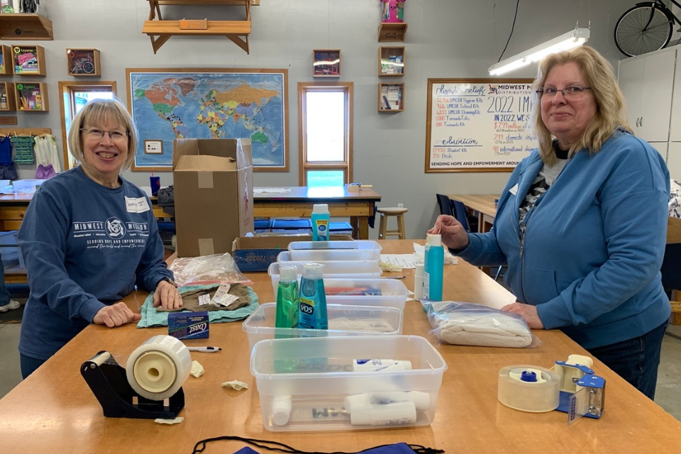 Volunteers packing Personal Dignity Kits