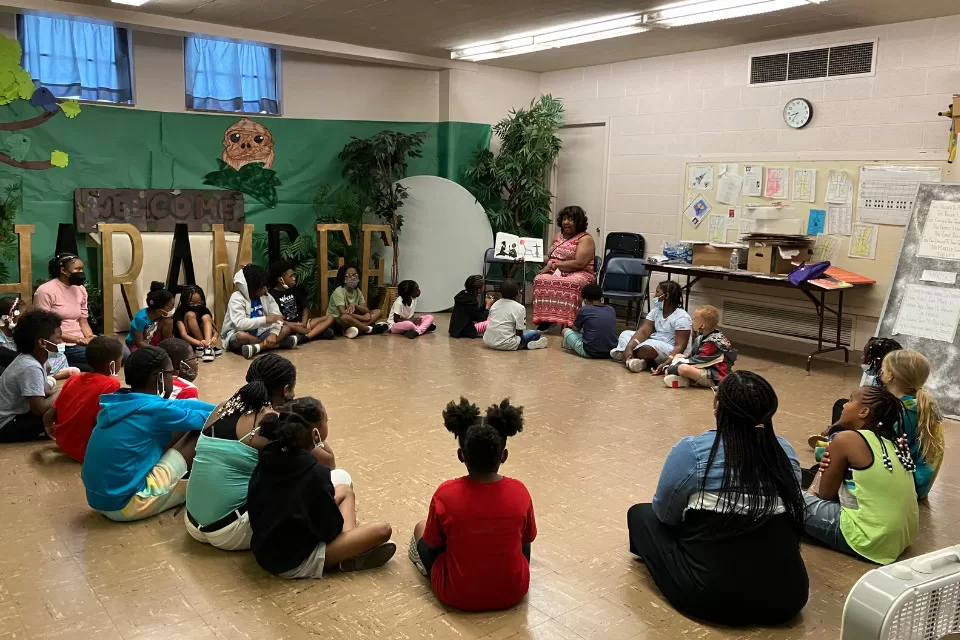 Children being read to by a teacher