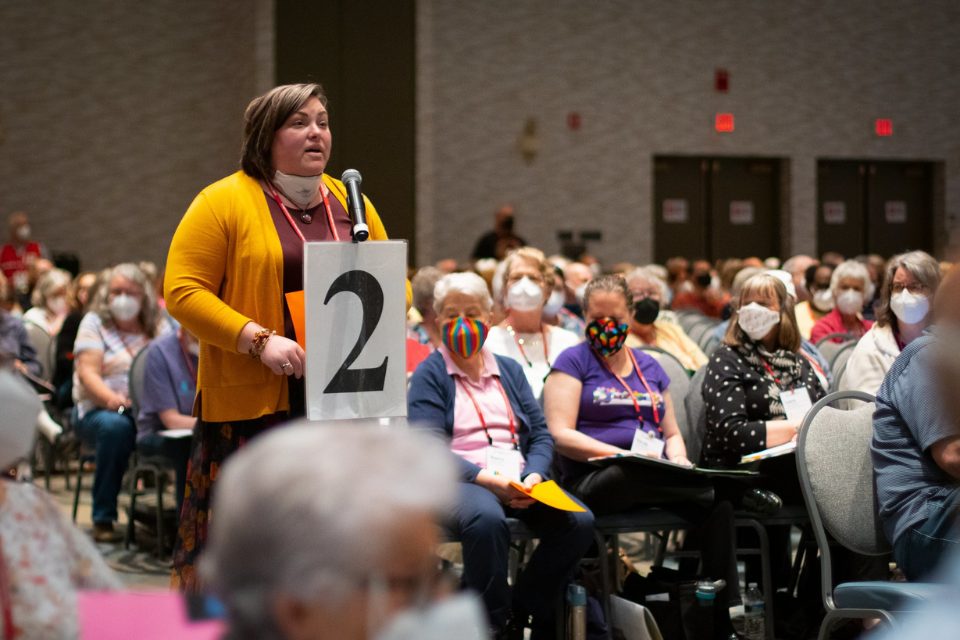 Woman speaking at microphone