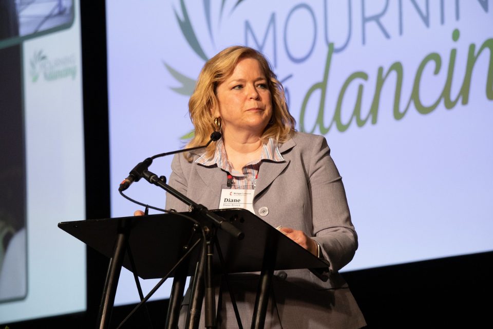 Woman speaking at microphone