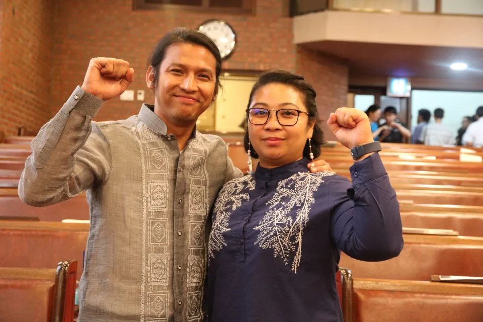 Man and woman attending worship