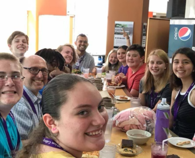 Bishop Bard and youth eating lunch at Mission u