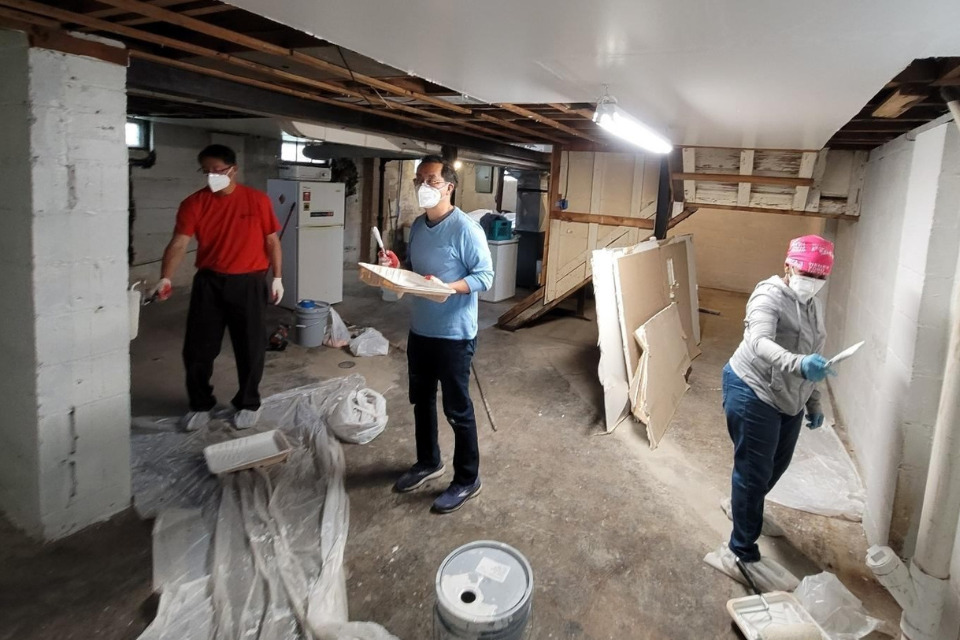 Church members helping clean up after a flood