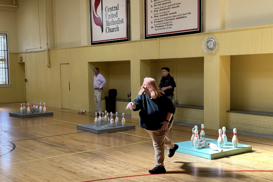 Playing foot bowl in the gymnasium