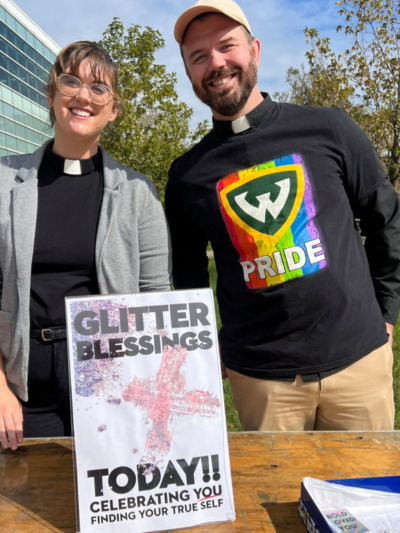 Clergy offering glitter on National Coming Out Day