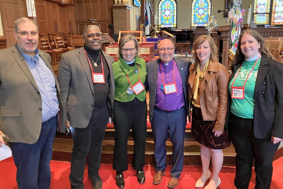 Coordinators of Advocacy Day standing with Bishop Bard