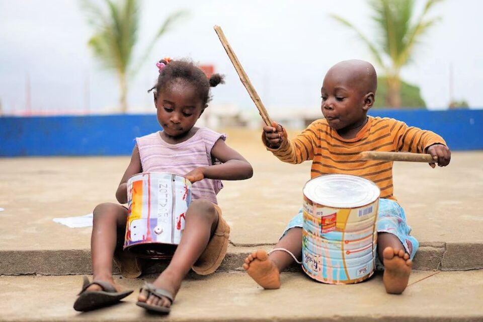 Two children playing instruments