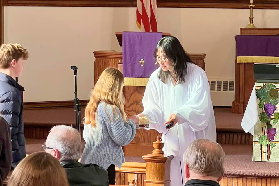 Pastor serving communion