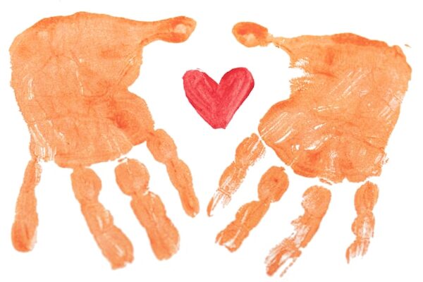 two orange handprints with a red heart in the middle