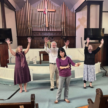 Worshipers dancing in church