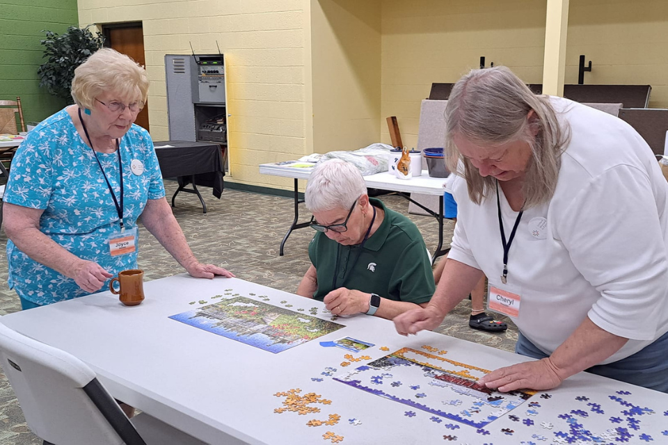 Women putting together a puzzle