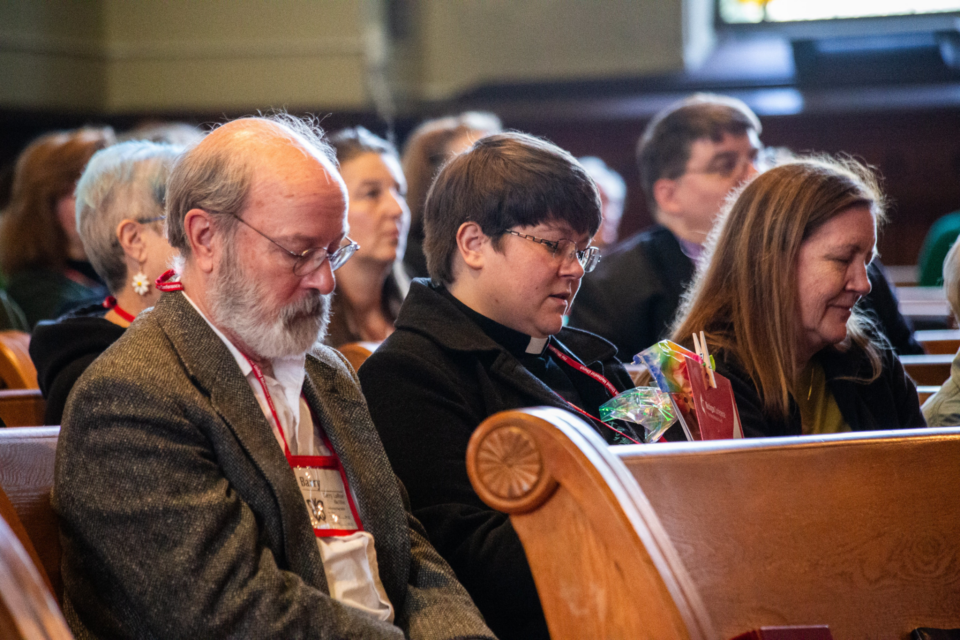 People sitting in pews