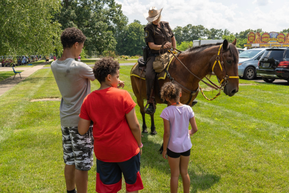 Children petting horse