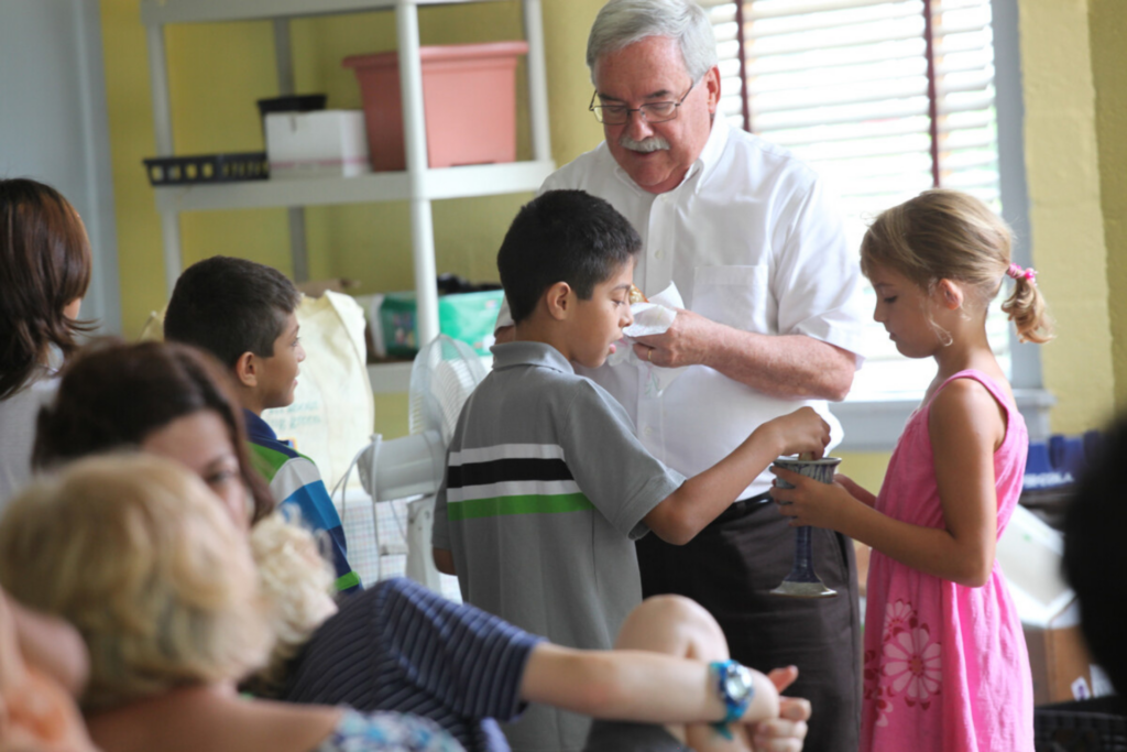 Children serving communion