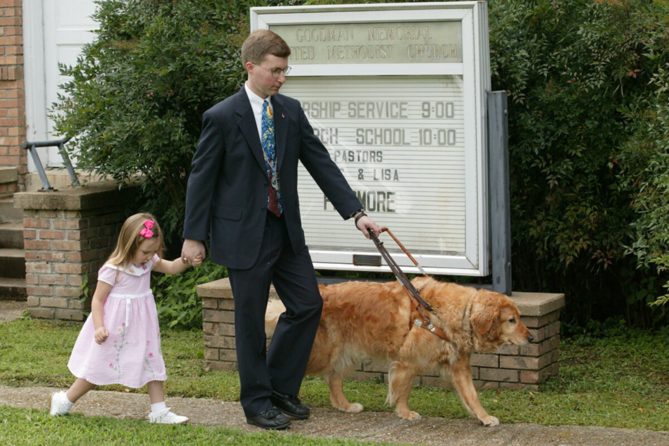 Man with Seeing Dog with daughter