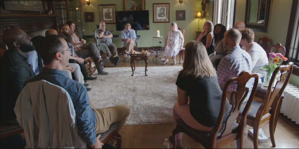 People sitting around in a circle having a conversation