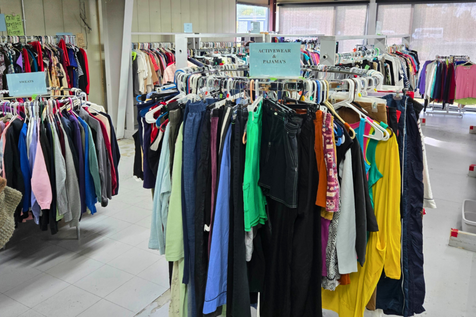 Racks of clothing at a free store