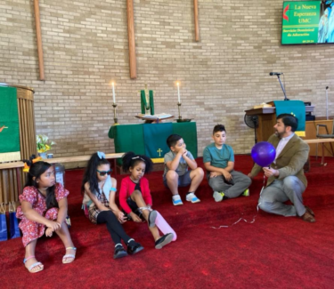 Pastor giving children's sermon