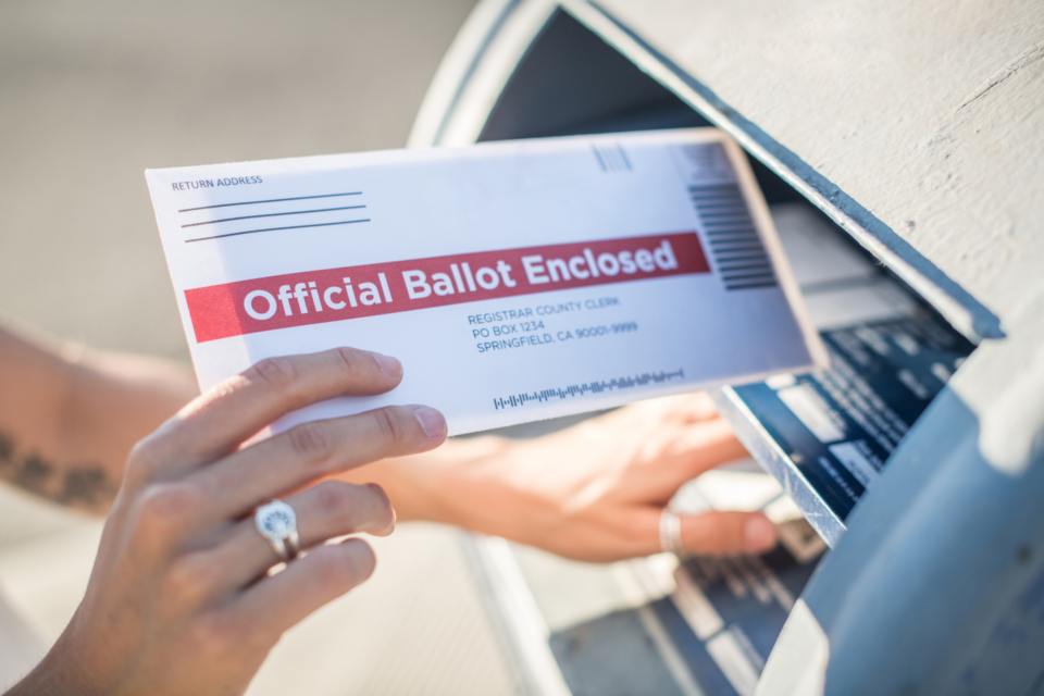 Putting absentee ballot in mail