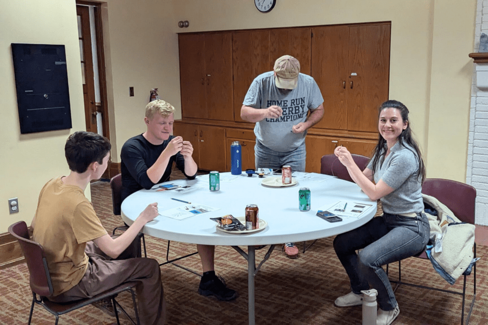 Group of people working on fishing gear