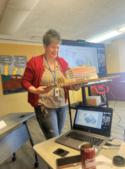 Woman holding architectural model