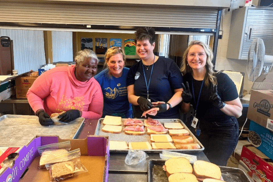 Staff packing sack lunches for homeless population