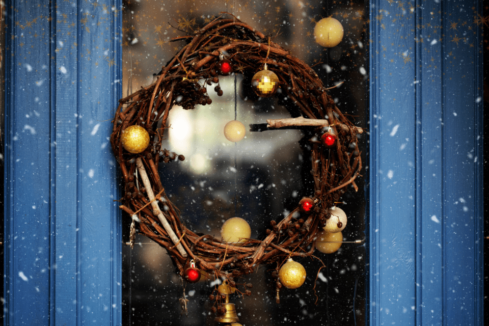 Christmas wreath hangs on a door