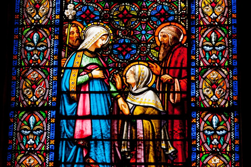 Stained glass window showing Elizabeth visiting Mary, the mother of Jesus