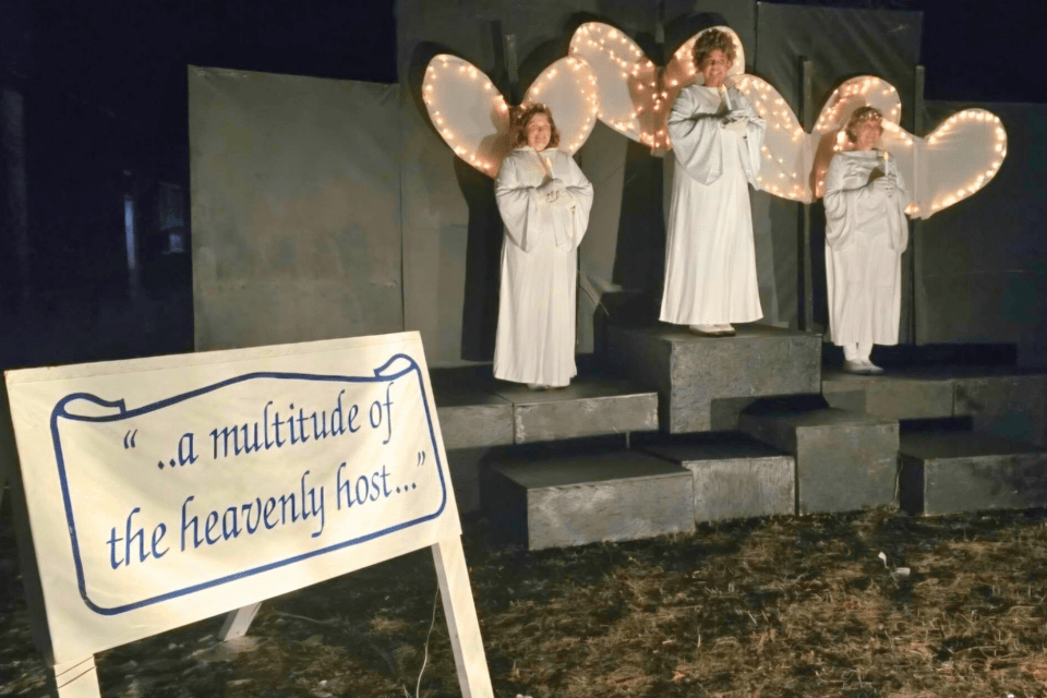 People dressed up as Christmas angels