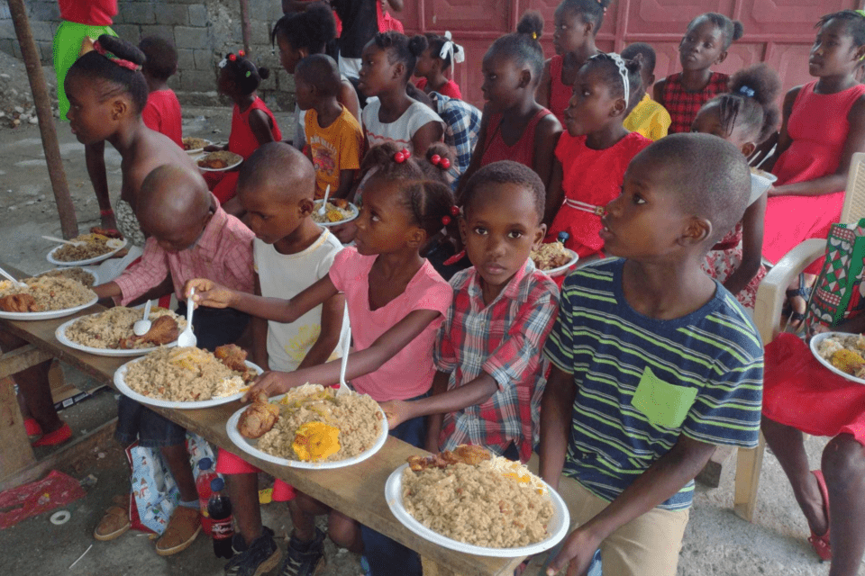 Children in Haiti enjoy a meal