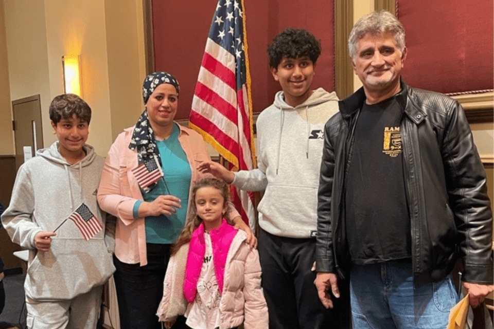 Members of a family originally from Iraq become U.S. citizens