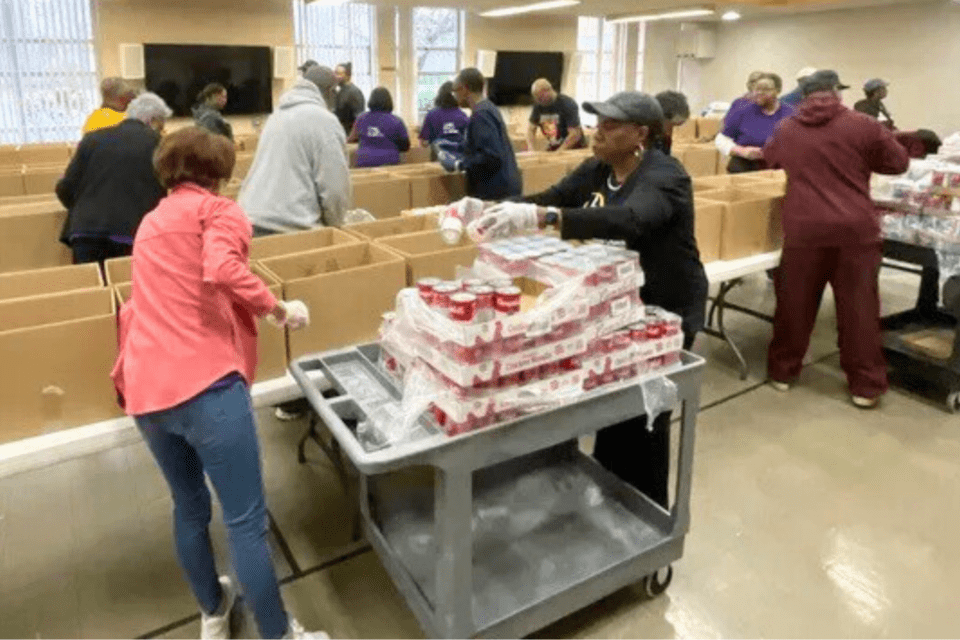 Food pantry volunteers packing boxes