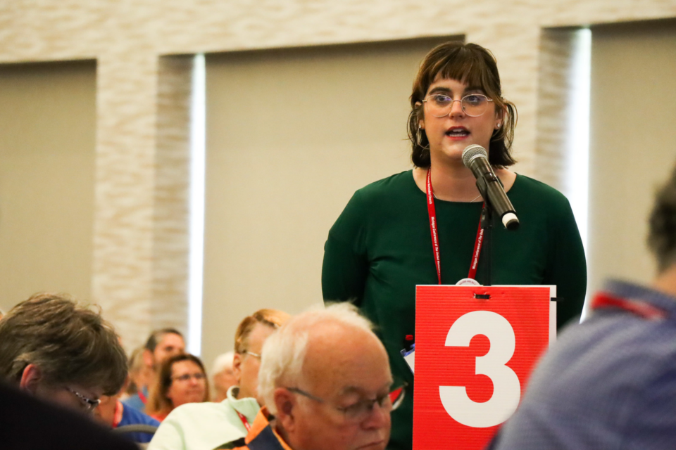 Woman speaking at a microphone