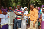 People celebrate the operation of a new drinking well
