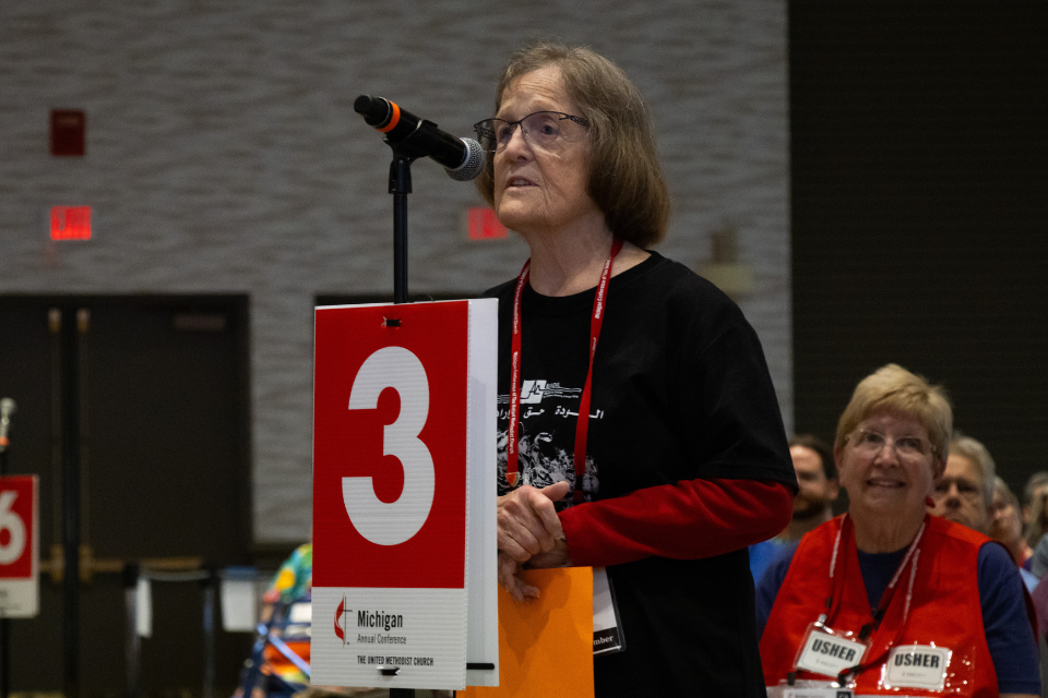 Woman speaking at a microphone