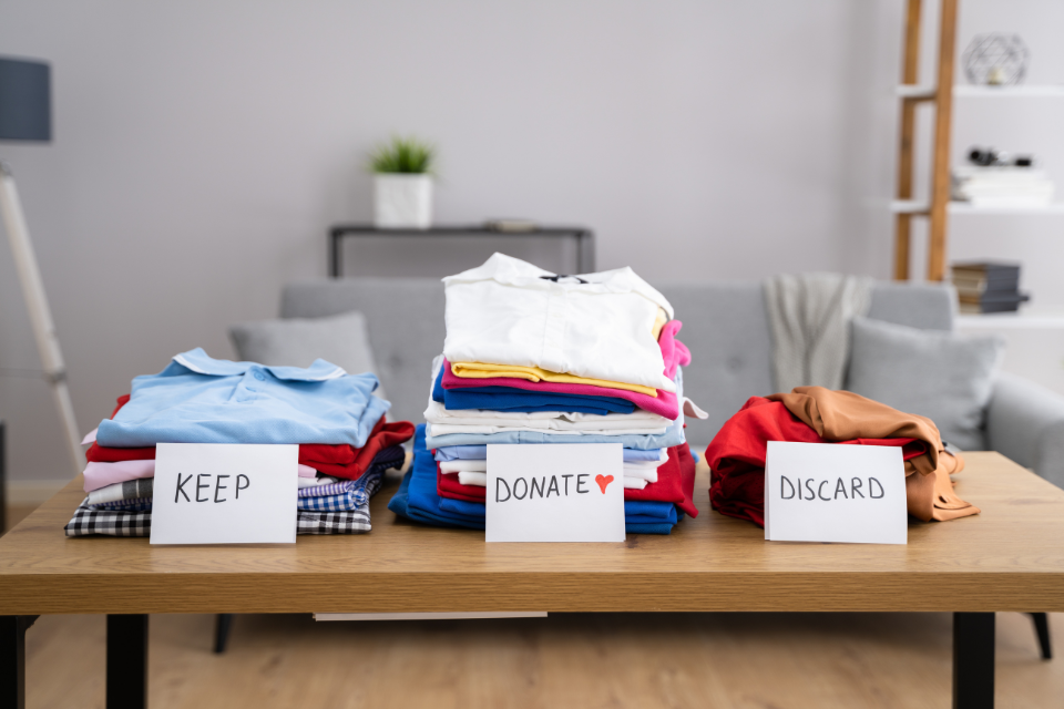 Sorting clothes while decluttering