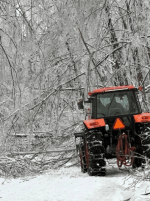 Tractor cleaning up after an ice storm