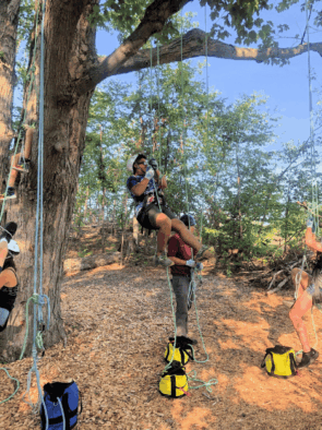 People enjoying a ropes course at camp
