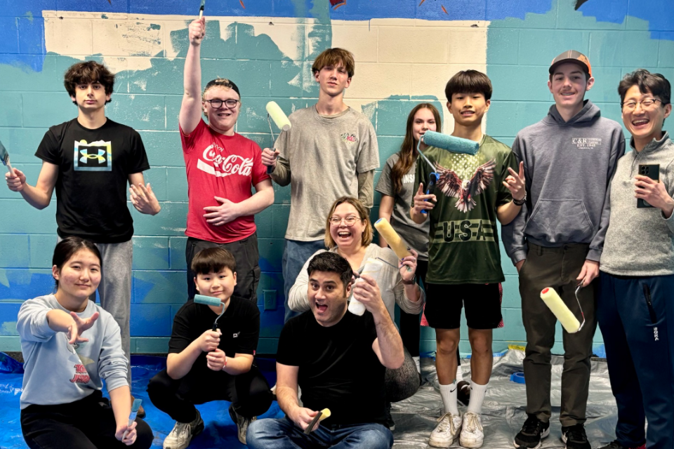 Youth painting a room