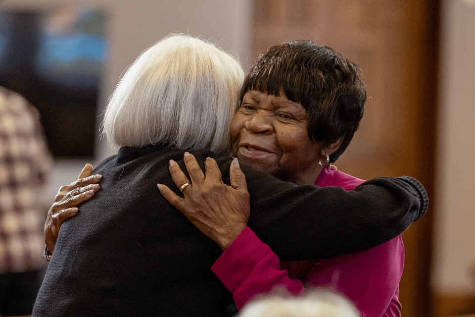 Two women hugging at church