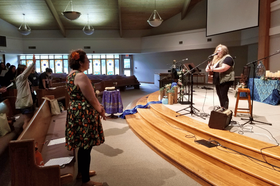 Woman leading worship