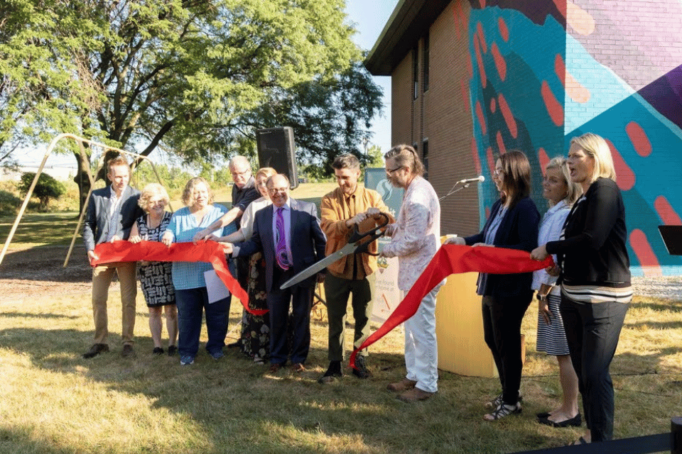 Ribbon cutting at new mural press conference