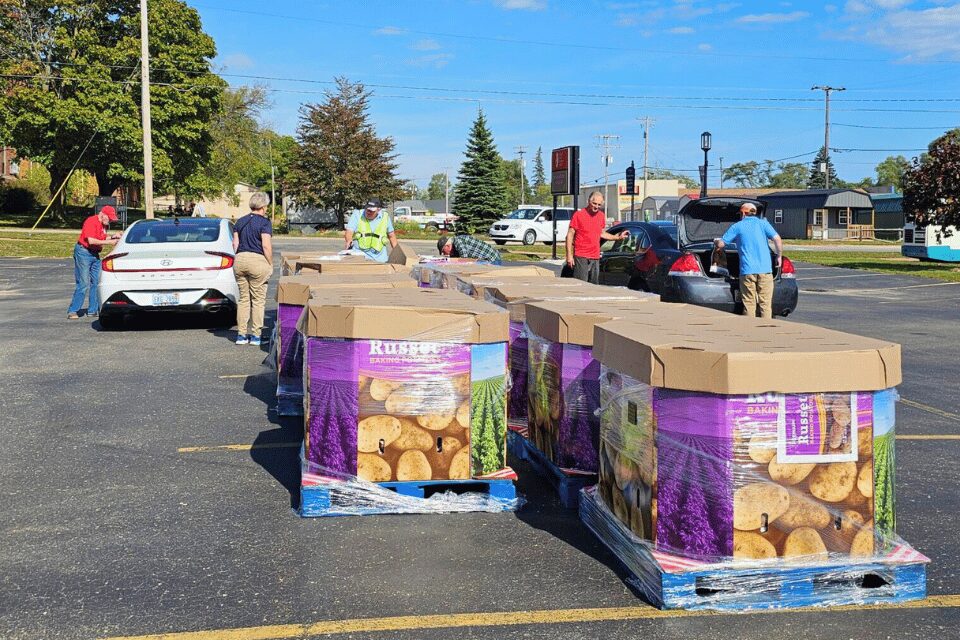 Passing out potatoes to those in need
