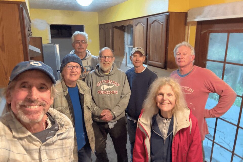 Volunteers repairing a home