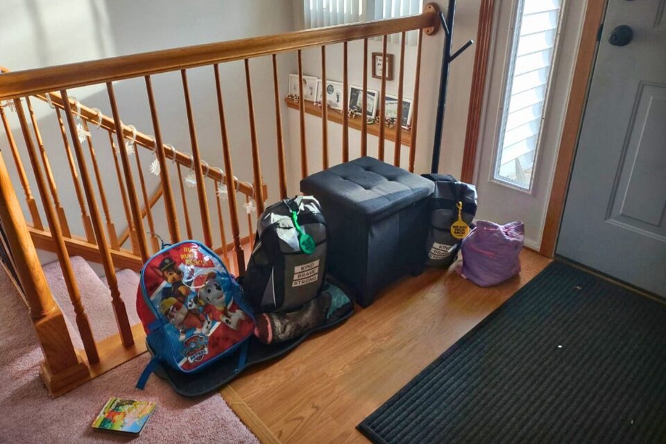 Bags packed sitting next to the front door