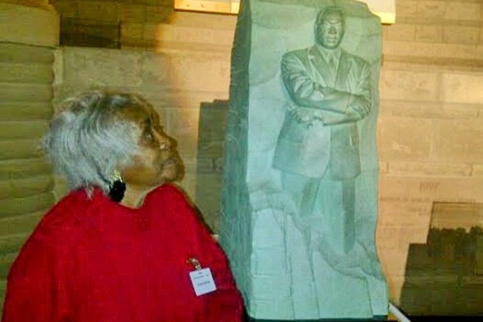 Woman looking at statue of MLK